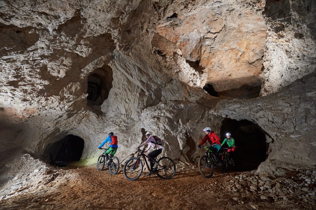 Visitors set off on bikes through the mighty mining tunnels of the former mine.