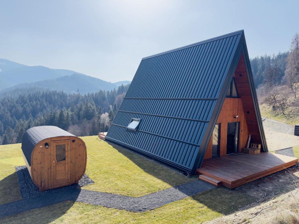 A modern wooden house with a sauna, surrounded by the peaceful nature of Pohorje.