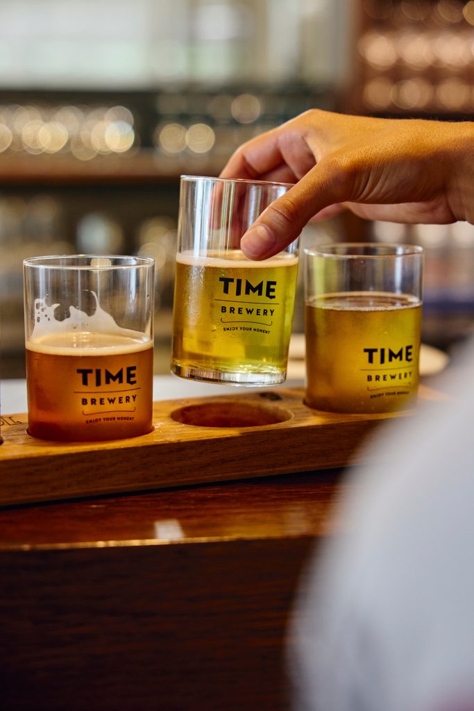 A selection of craft beers at the brewery, where visitors discover different beer flavors.