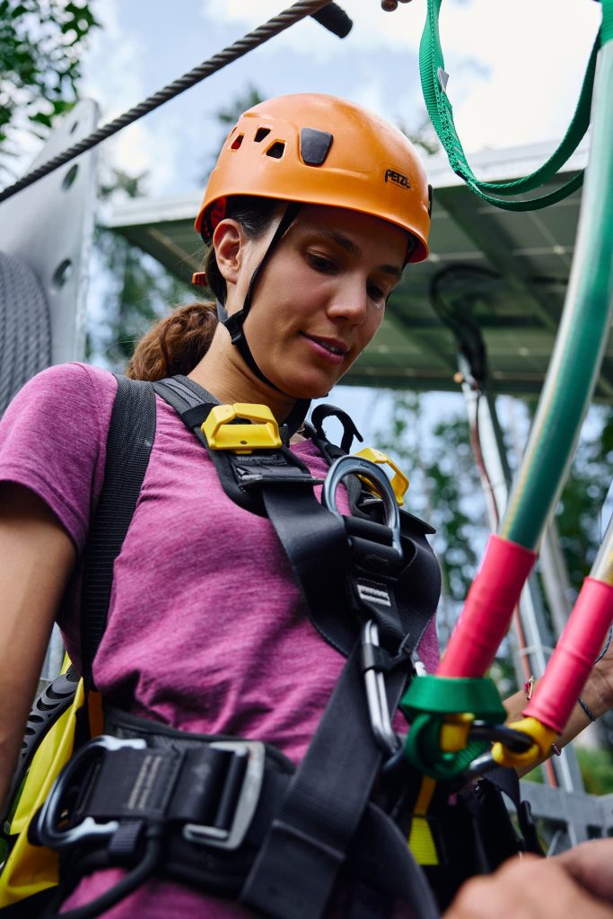 In a safety harness, with a helmet on your head and a touch of courage, the journey above the treetops of the Koroška forests begins.