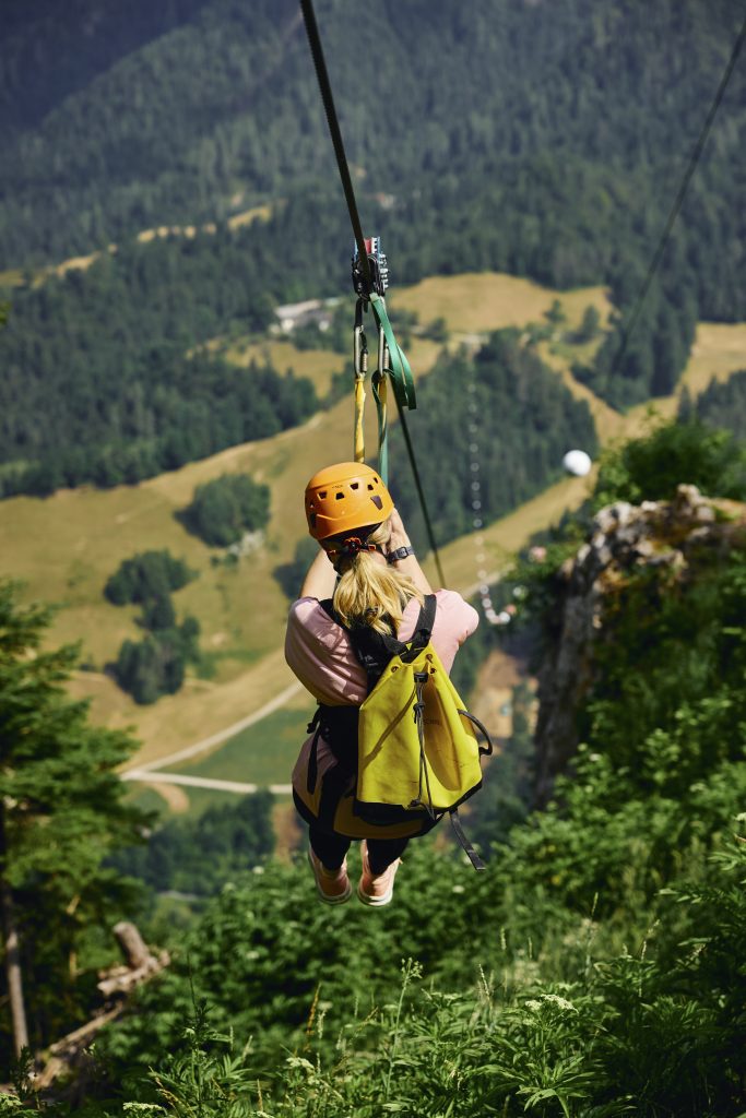 An aerial view of the Koroška forests and valley, where adrenaline intertwines with an unforgettable nature experience.
