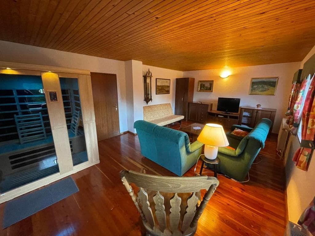 A spacious living room offering a comfortable corner for rest and socializing.