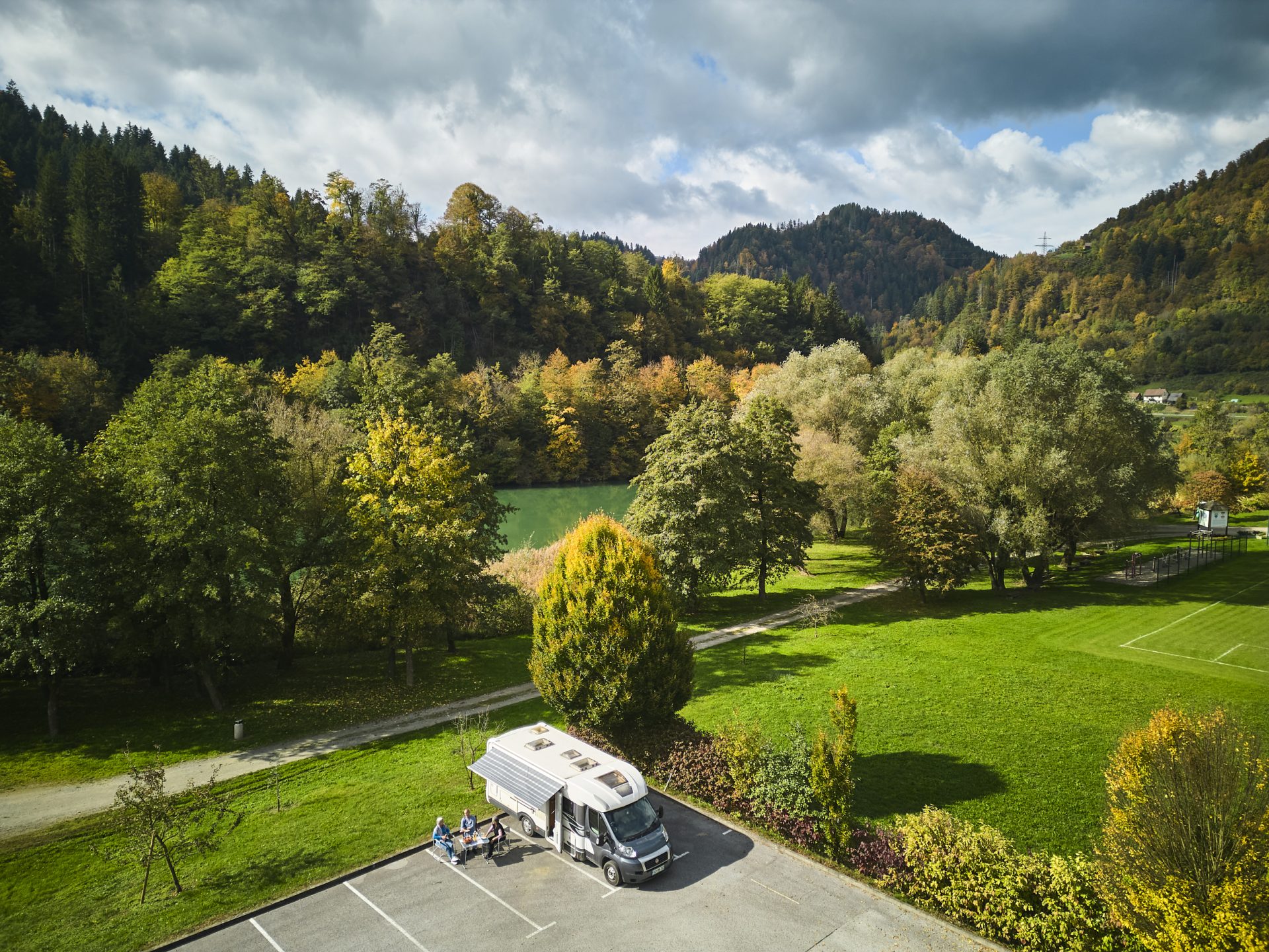 A well-maintained motorhome stop nestled in nature.