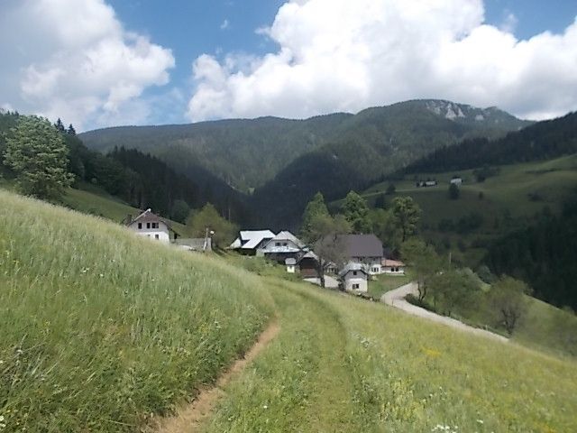 The authentic Koroška homestead Kumer, nestled among meadows, forests and peaks above Črna na Koroškem.