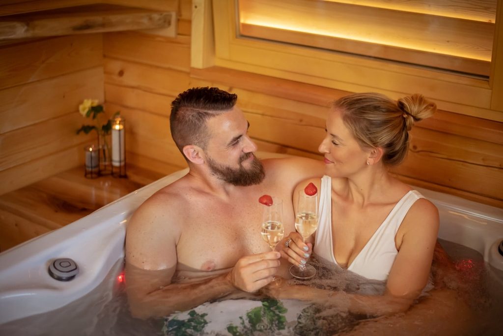Relaxation in a hot tub with sparkling wine.