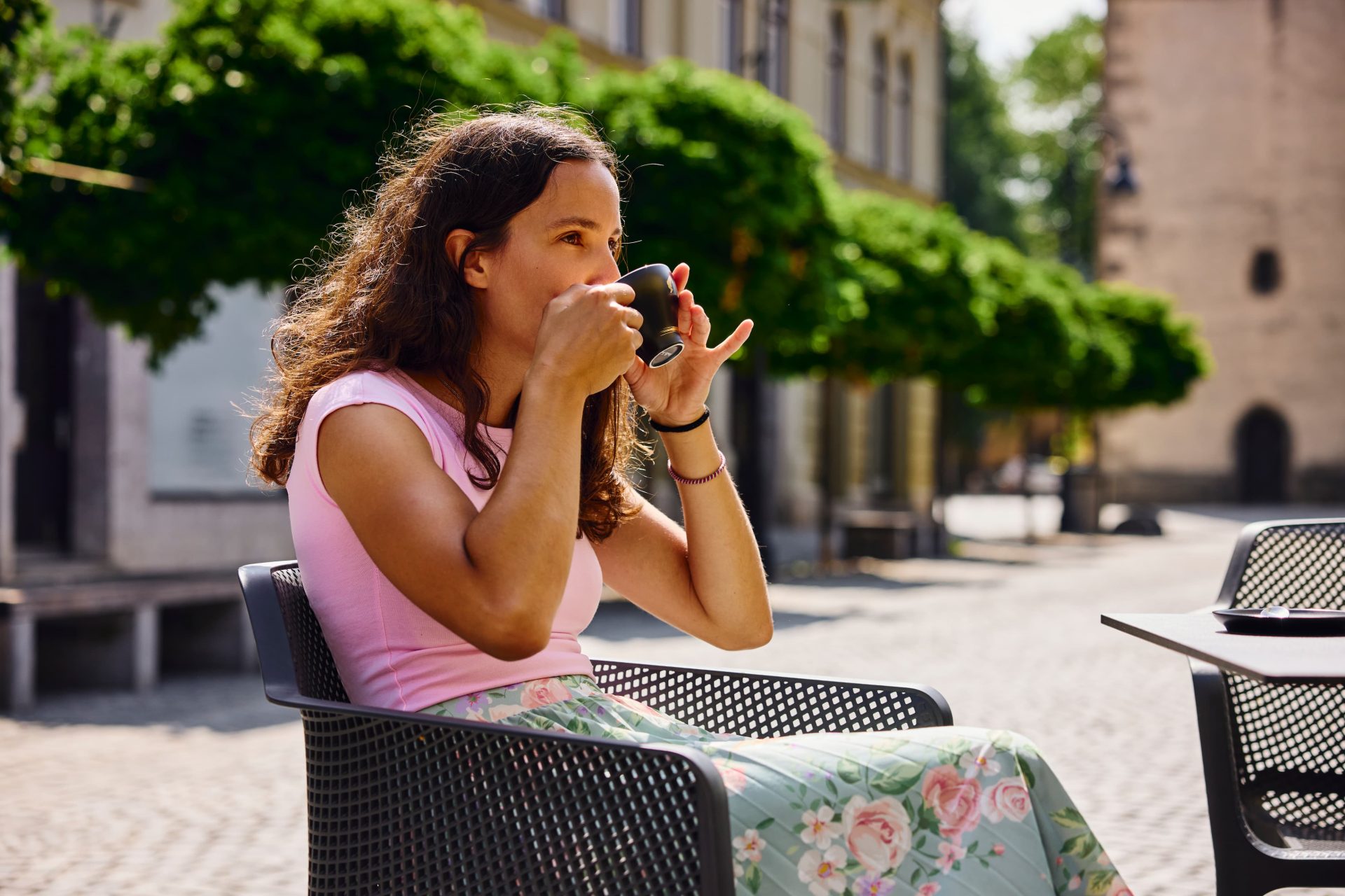 A visitor enjoys a cup of coffee in the pleasant atmosphere of the old town center of Slovenj Gradec.