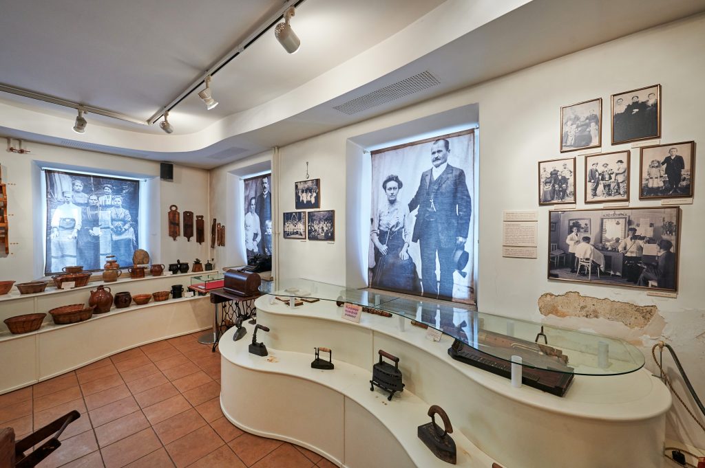 A museum space where stories of the daily lives of past generations come to life through old objects, photographs, and tools.