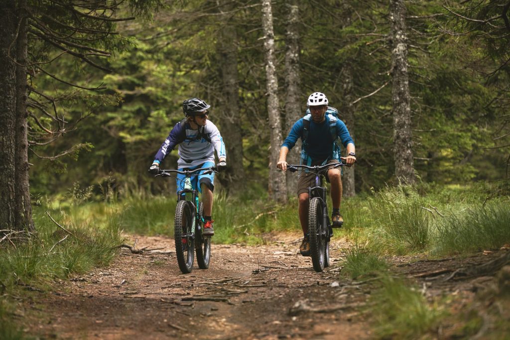Relaxed e-biking along the forest trails of Ribniško Pohorje.