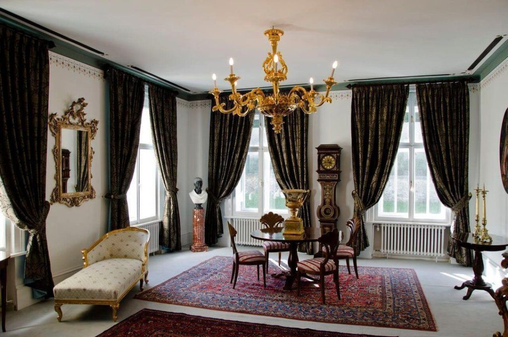 The Grand Salon of Bukovje Mansion, furnished with elegant antique furniture and luxurious decorative elements.