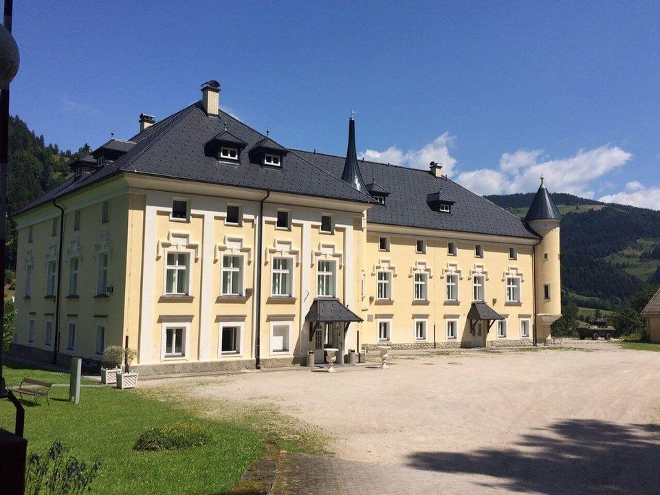 Bukovje Manor in Dravograd—a grand historic building with an elegant façade, distinctive turrets, and recognisable castle architecture.