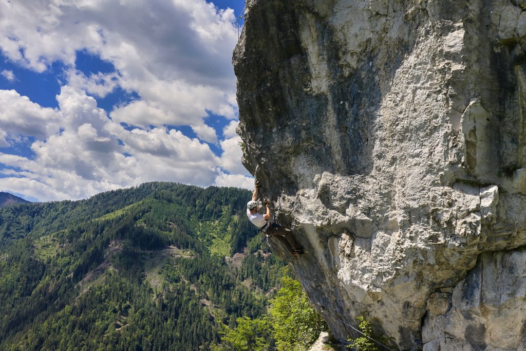 A climbing challenge in the middle of a mighty rock wall.