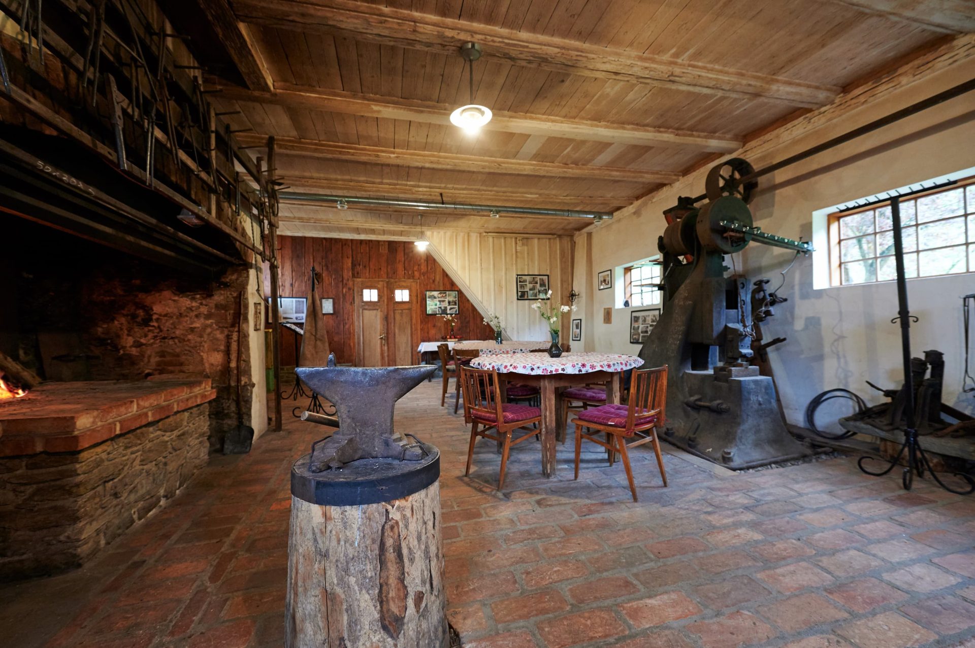 Interior of the smithy with preserved blacksmith tools, devices, and equipment that testify to the former work in the smithy.