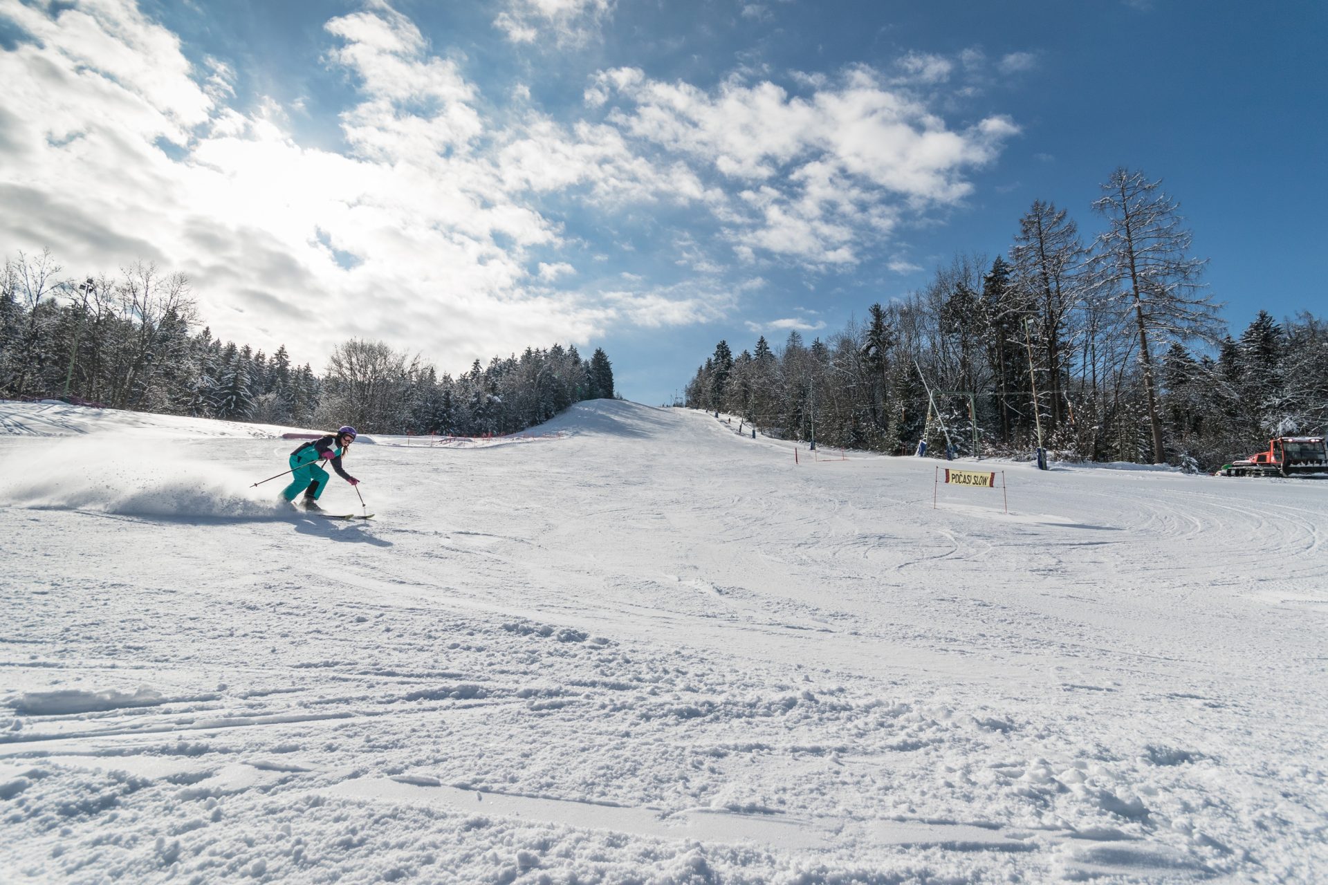 A skier carving turns at Poseka.