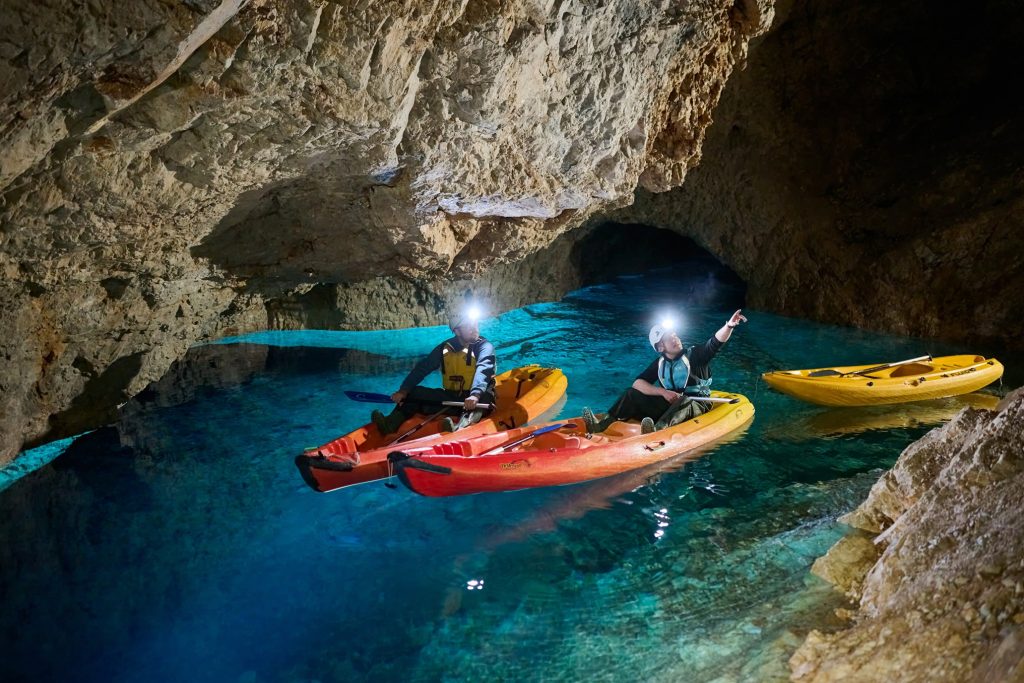 Viewing points of interest in the underground tunnels while kayaking.