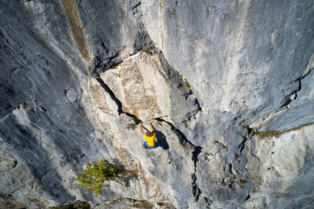 A climber ascending a rock face.