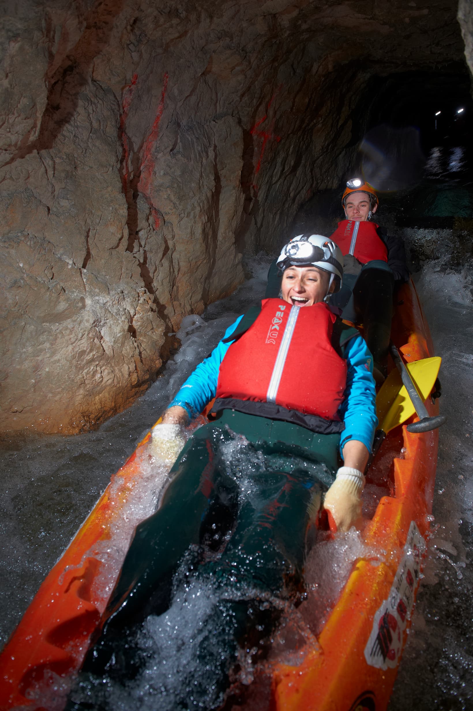 Water reaches into the kayak, and wet feet only add to the cheerful underground adventure.