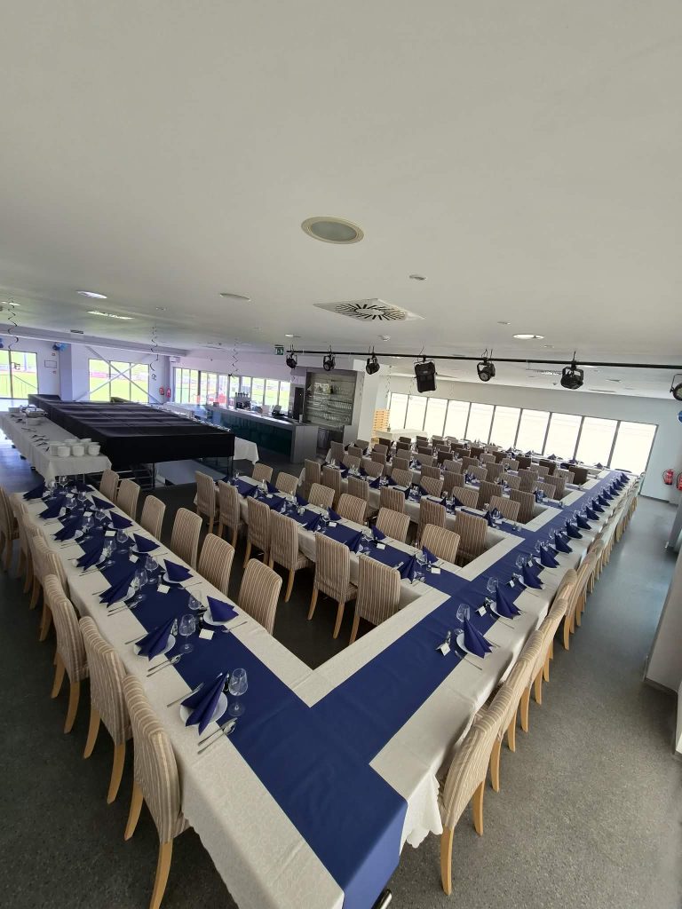 Hospitality area with tables for refreshments and socializing.