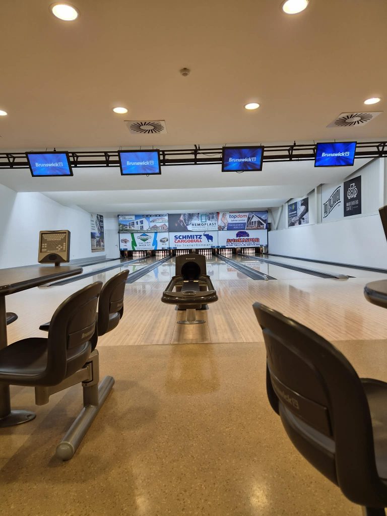 Bowling lane with pins for fun and socializing.