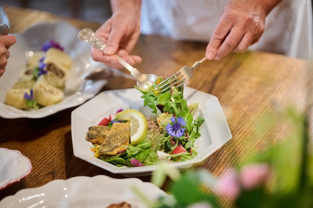 A carefully served dish decorated with flowers.