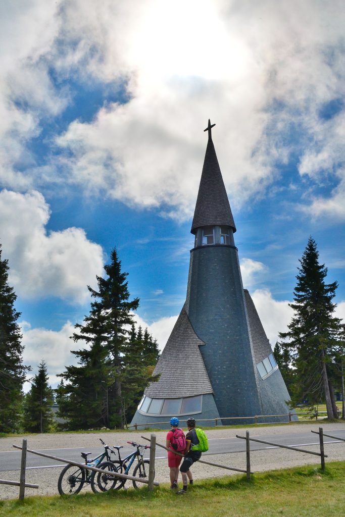 Cycling stop with a view of the church on Rogla.