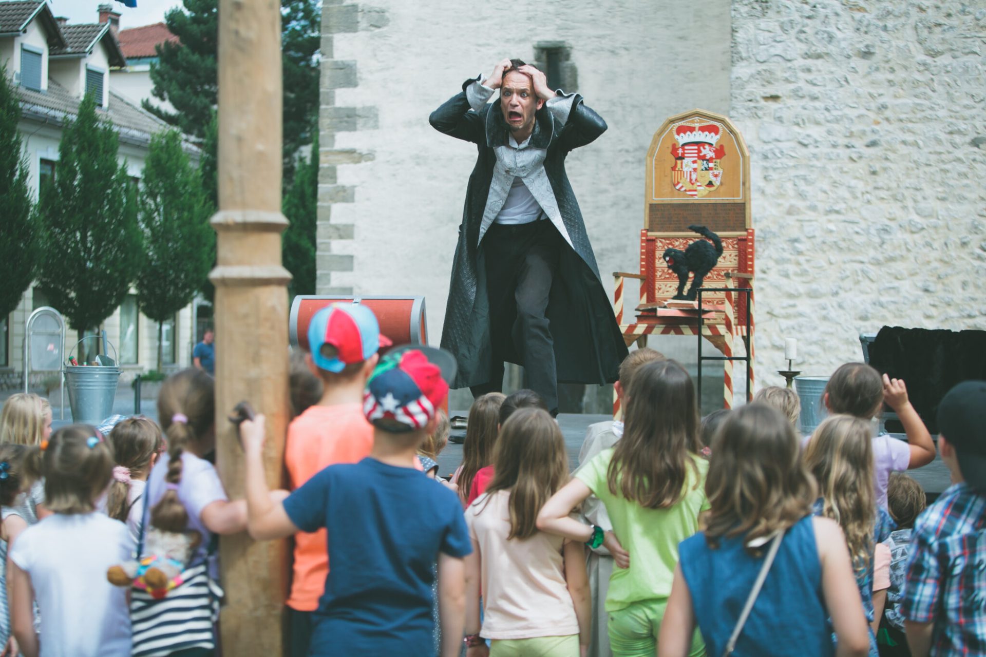 An entertaining street performance that attracted a crowd of young visitors.
