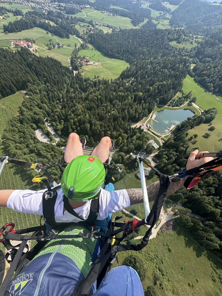 Two people in tandem enjoying the view high above Koroška.